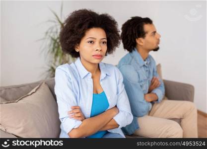 people, relationship difficulties, conflict and family concept - unhappy couple having argument r at home. unhappy couple having argument at home