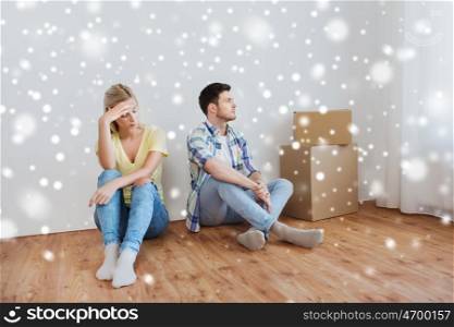 people, relationship difficulties, divorce, conflict and family concept - unhappy couple having argument or break up at home over snow