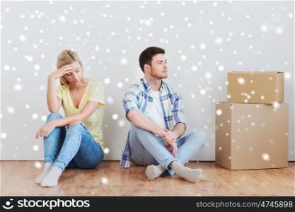 people, relationship difficulties, divorce, conflict and family concept - unhappy couple having argument or break up at home over snow