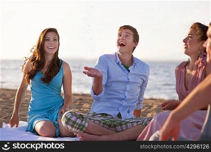 People relaxing together on beach