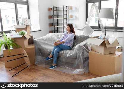 people, repair and real estate concept - happy smiling asian woman with stuff moving to new home. happy asian woman with stuff moving to new home