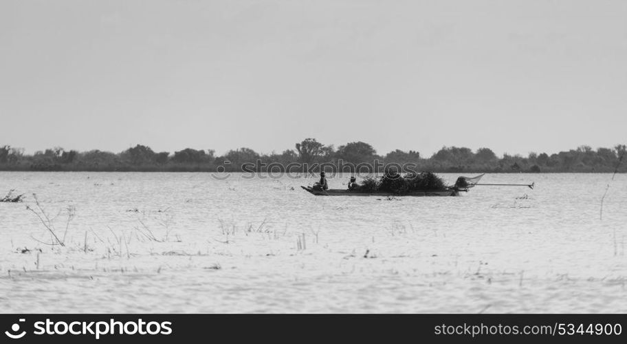 People rowing boat in Tonle Sap lake, Kampong Phluk, Siem Reap, Cambodia . People rowing boat in Tonle Sap lake, Kampong Phluk, Siem Reap, Cambodia