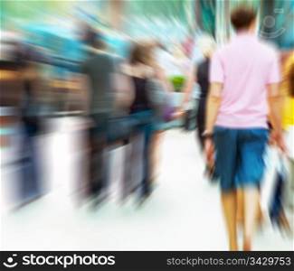 People rush on crowded street. Motion blur
