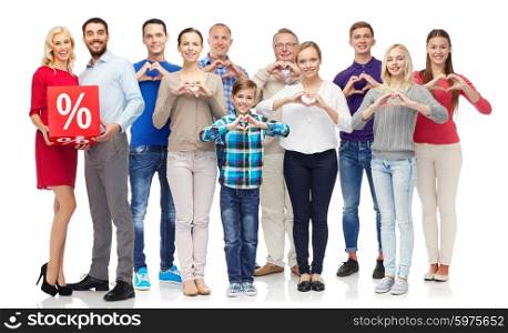 people, sale, discount and shopping concept - happy people with red percentage sign showing heart shape