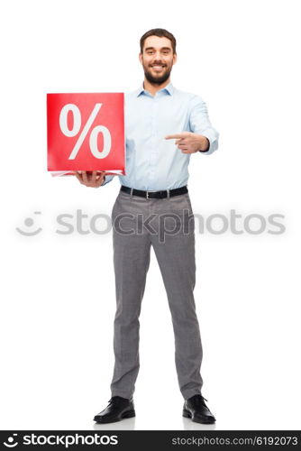 people, sale, shopping, discount and holidays concept - smiling man holding and pointing finger to red percentage sign