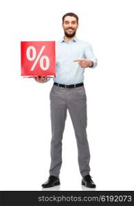 people, sale, shopping, discount and holidays concept - smiling man holding and pointing finger to red percentage sign