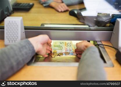 people, saving, currency exchange and finance concept - hands taking cash money at bank office