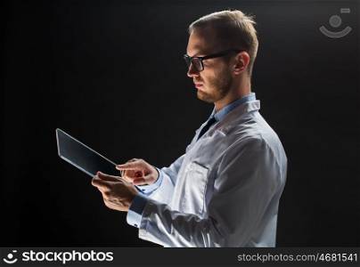 people, science, technology and medicine concept - close up of male doctor or scientist in white coat with tablet pc computer over black background