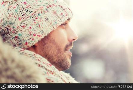 people, season and leisure concept - face of happy man outdoors in winter. face of happy man outdoors in winter