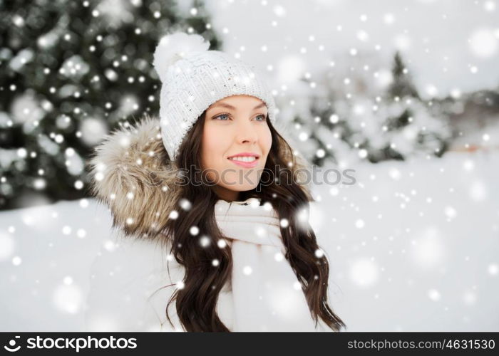 people, season and leisure concept - happy woman outdoors in winter