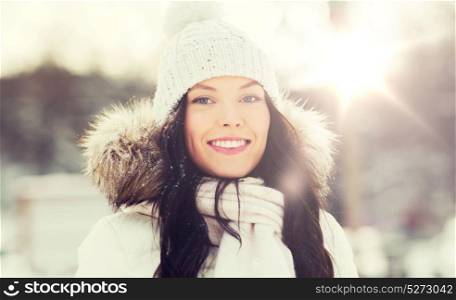 people, season and leisure concept - happy woman outdoors in winter clothes. happy woman outdoors in winter clothes