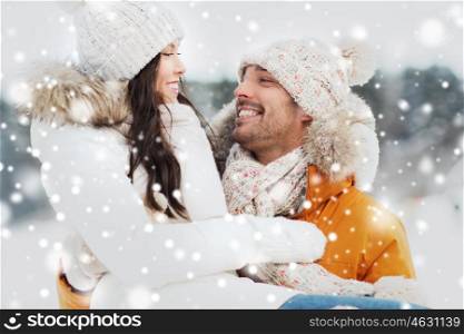 people, season, love and leisure concept - happy couple outdoors in winter