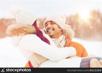 people, season, love and leisure concept - happy couple outdoors in winter