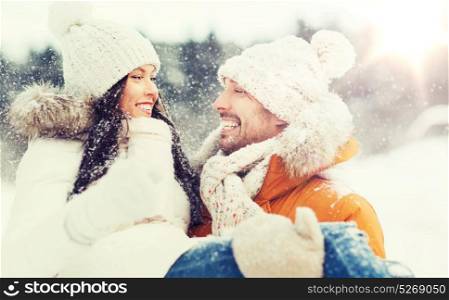people, season, love and leisure concept - happy couple outdoors in winter. happy couple outdoors in winter