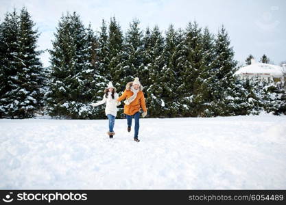 people, season, love and leisure concept - happy couple running in winter snow