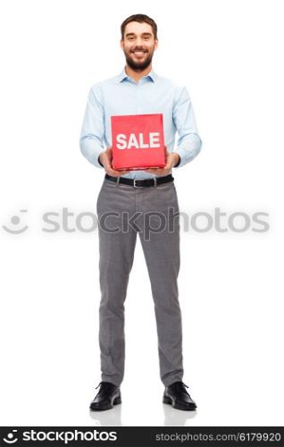 people, shopping, discount and holidays concept - smiling man holding red sale sign