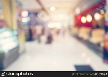 People shopping in department store. Defocused blur background.

