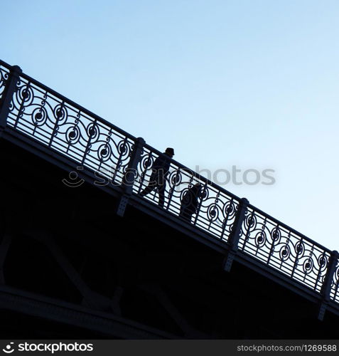 people silhouette on the bridge in Bilbao city Spain