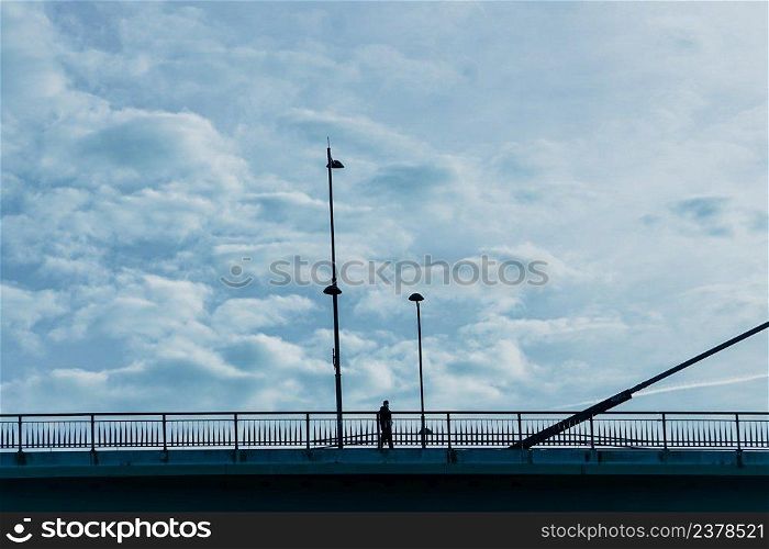 people silhouette on the bridge in Bilbao city, Spain
