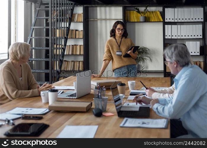 people sitting desk meeting