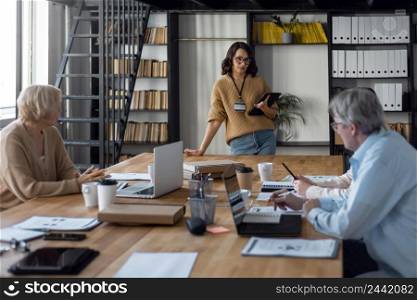people sitting desk meeting
