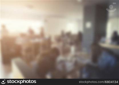 people sitting in cafe coffee shop for background, vintage tone and defocused