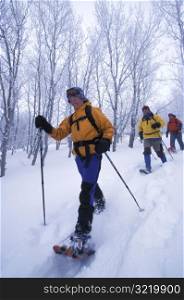 People Snowshoeing Together