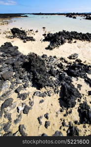 people spain hill yellow beach spiral of black rocks in the lanzarote