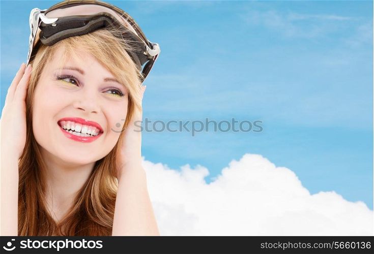 people, sports and happiness concept - smiling teenage girl in snowboard goggles