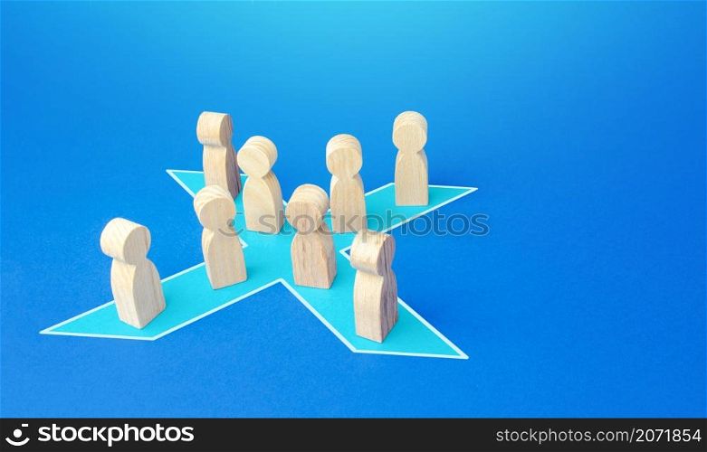 People stand in shape of a blue x. Combining forces to successfully solve the problem. Social tension, protest. Unification into a political party. Consolidation, cooperation and collaboration.