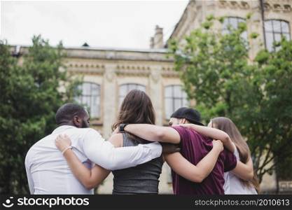 people standing together hugging