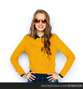people, style and fashion concept - happy young woman or teen girl in casual clothes and sunglasses
