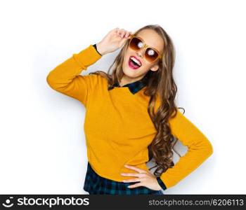people, style and fashion concept - happy young woman or teen girl in casual clothes and sunglasses having fun