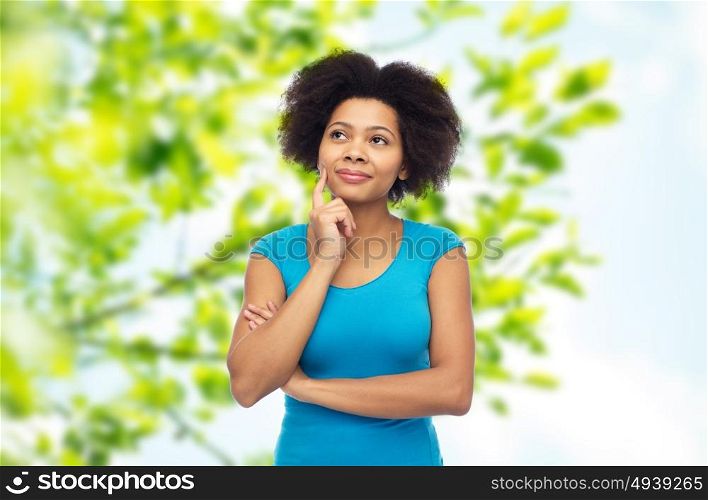 people, summer and eco concept - happy afro american young woman over green natural background. happy afro american young woman over white