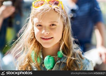 people, summer and portrait concept - happy teenage girl with headphones