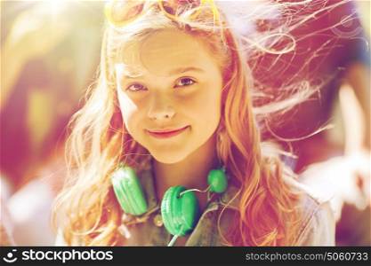 people, summer and portrait concept - happy teenage girl with headphones. happy teenage girl with headphones