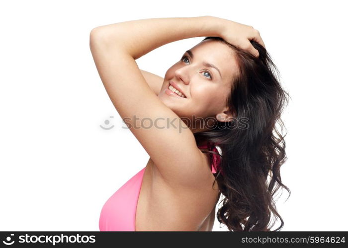 people, summer, beauty and beach concept - happy young woman in pink swimsuit with long wavy hair