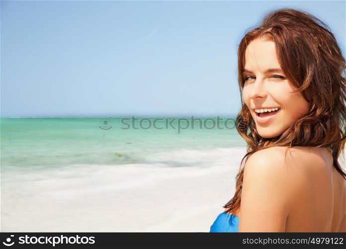 people, summer holidays, vacation and travel concept - happy smiling young woman enjoying sun over exotic tropical beach and sea shore background. happy smiling young woman on tropical beach