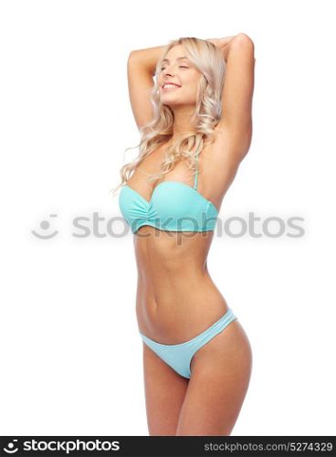 people, swimwear and summer concept - happy smiling young woman in bikini swimsuit. happy smiling young woman in bikini swimsuit