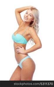 people, swimwear and summer concept - happy smiling young woman in bikini swimsuit. happy smiling young woman in bikini swimsuit
