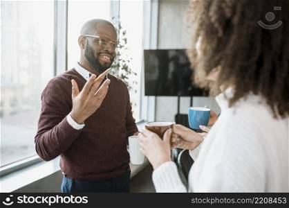 people talking each other coffee during meeting