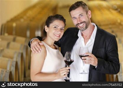 people tasting wine in cellar
