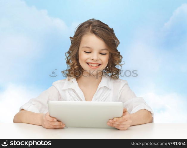 people, technology and children concept - happy smiling girl with tablet pc computer over blue sky background