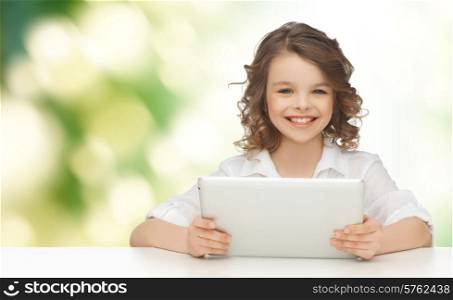 people, technology and children concept - happy smiling girl with tablet pc computer over green background