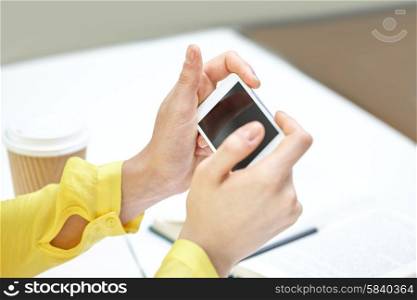 people, technology and internet concept - close up of teenage girl hands with smartphone at home