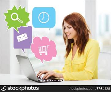 people, technology and internet concept - smiling woman sitting on couch with laptop computer at home with internet icons