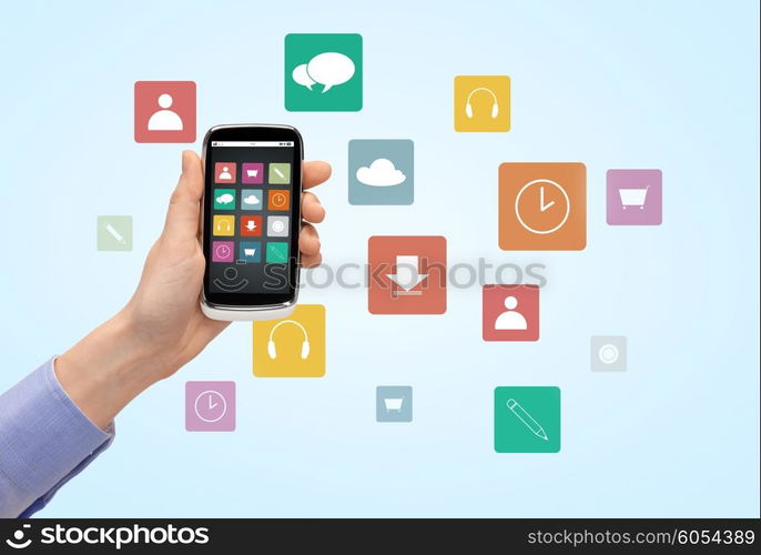 people, technology and media concept - close up of woman hand with smartphone with application icons on screen