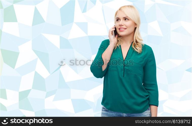 people, technology, communication and leisure concept - happy young woman calling on smartphone over blue background