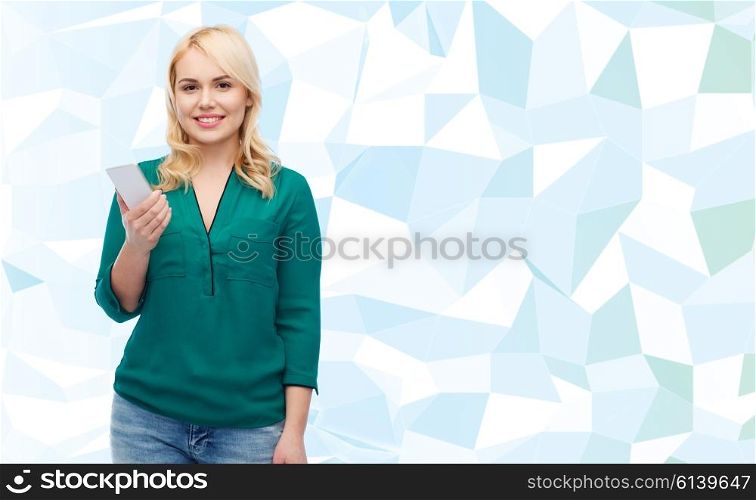 people, technology, communication and leisure concept - happy young woman with smartphone over blue background
