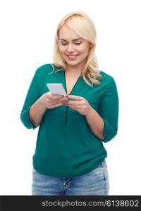 people, technology, communication and leisure concept - happy young woman with smartphone texting message